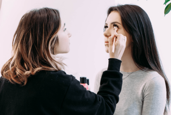 makeup artist applying makeup on client during consultation