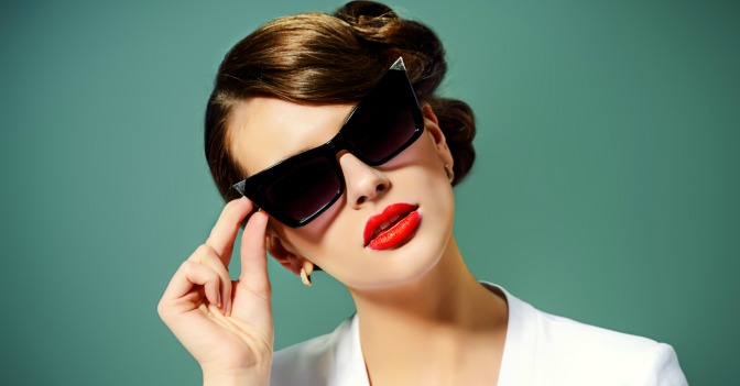 Woman wearing sunglasses and red lipstick