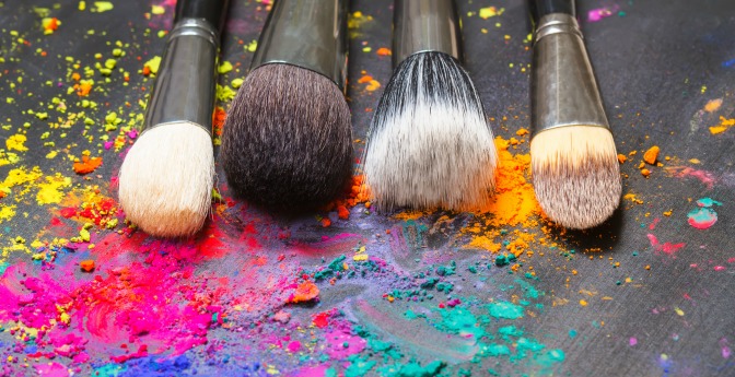 Makeup brushes and bright powder makeup