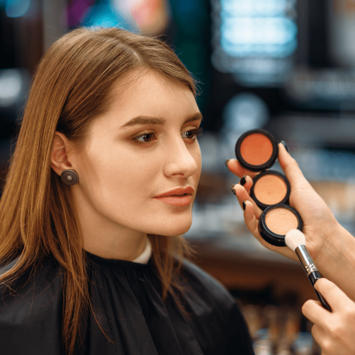 sephora client having makeup applied to them by beauty counter makeup artist