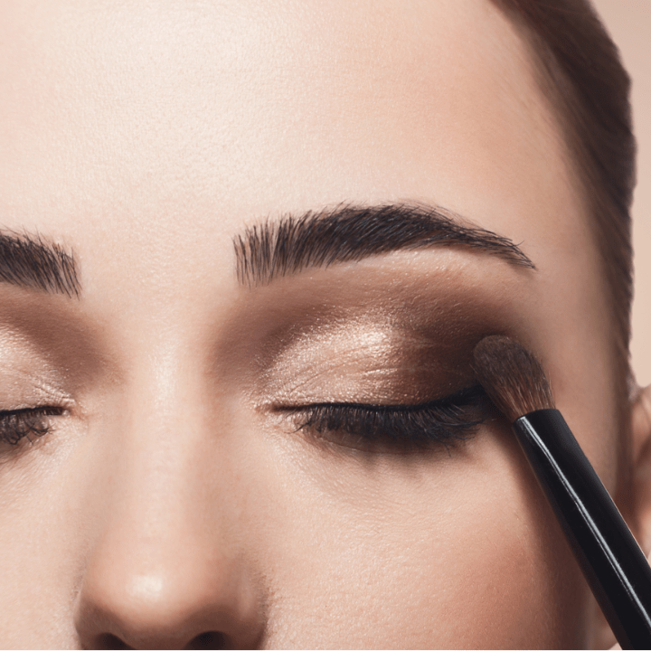 upclose of eyeshadow being applied to woman's eye