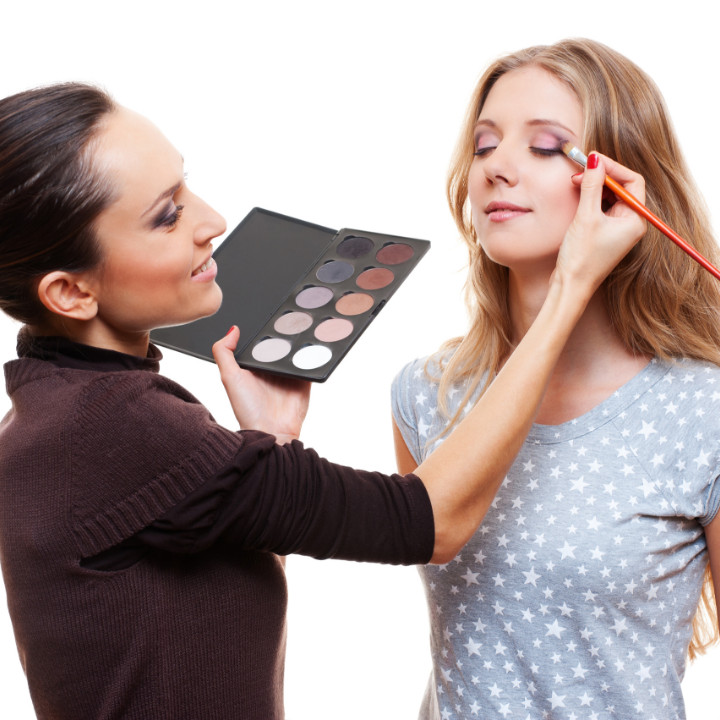 professional makeup artist with client