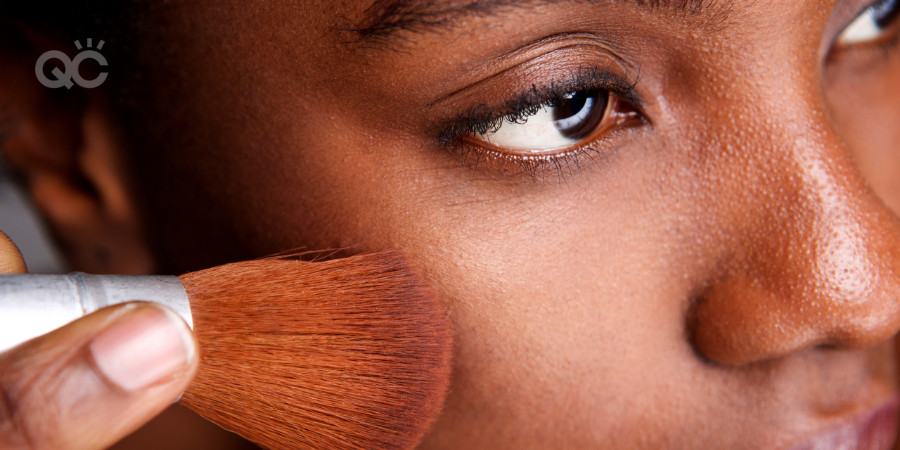 applying foundation on dark skin