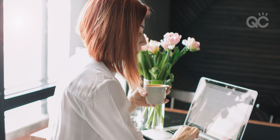 woman doing independent research on her laptop regarding first steps in her career in makeup artistry