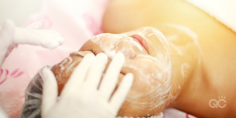 esthetician practice giving facial to client