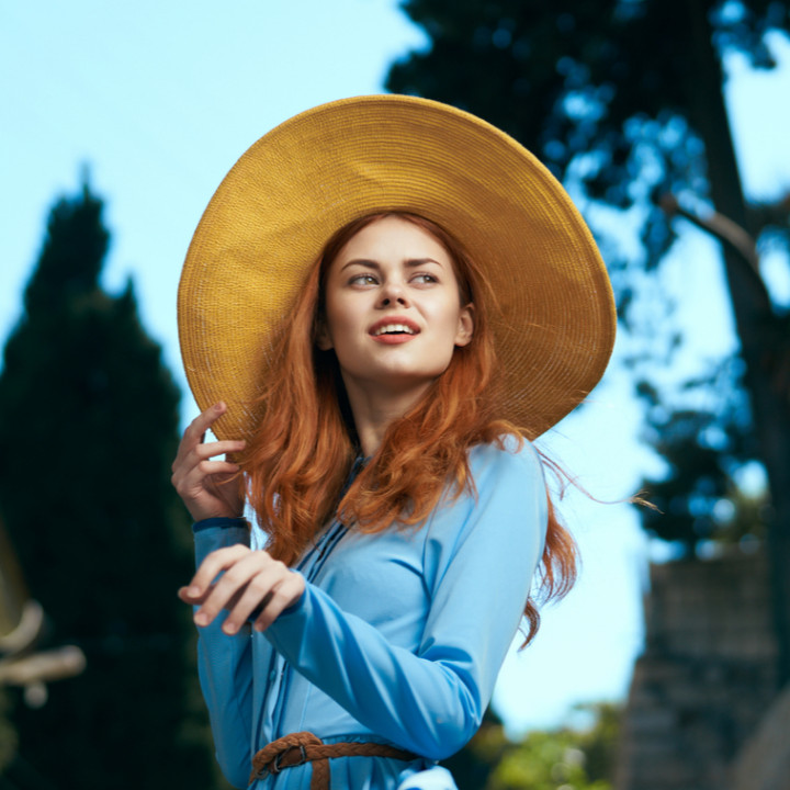 fashion styling course leads to successful fashion career - red head girl blue dress sun hat on