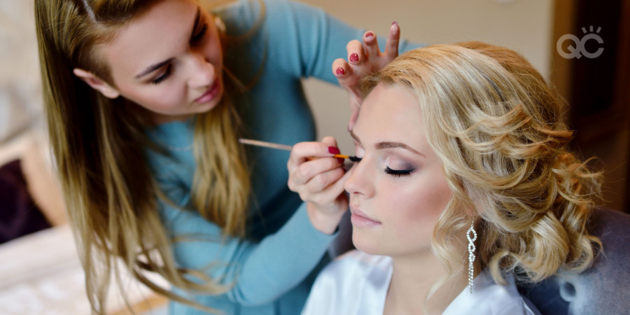 makeup artist applying makeup in the client early in the morning