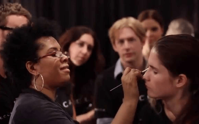 DeShawn Hatcher doing makeup on female model