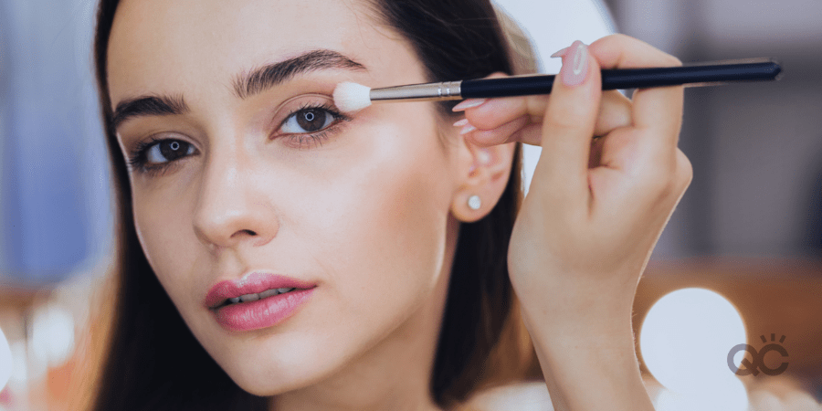 woman applying eyeshadow