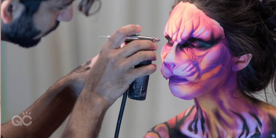 special fx makeup - man airbrushing animal look on client's face