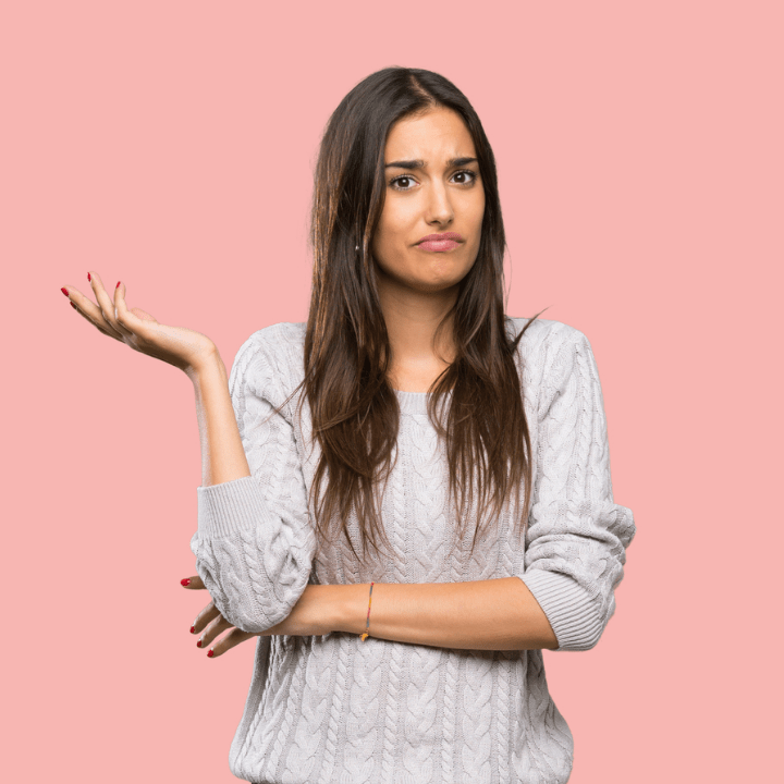 frustrated woman shrugging one arm, unsure what she's supposed to do