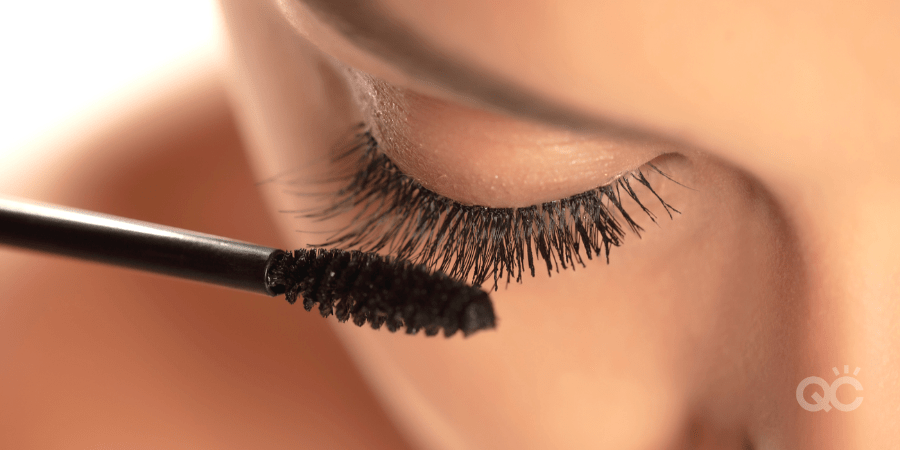 upclose of long lashes and mascara wand