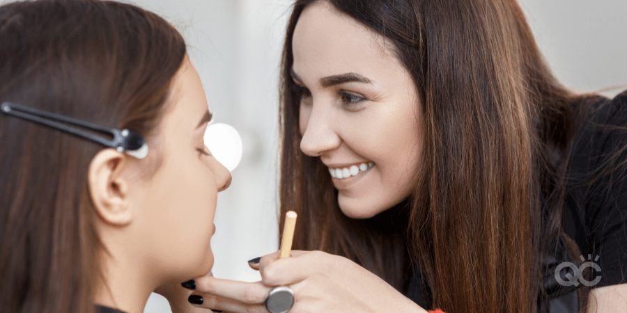 happy MUA doing makeup for young girl