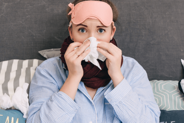 woman sick in bed