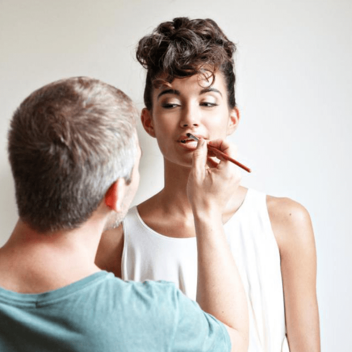 QC makeup classes instructor, Nathan Johnson, doing makeup on female model