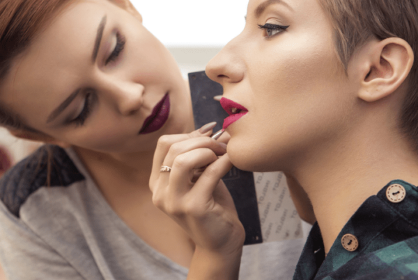 makeup artist doing makeup on female client