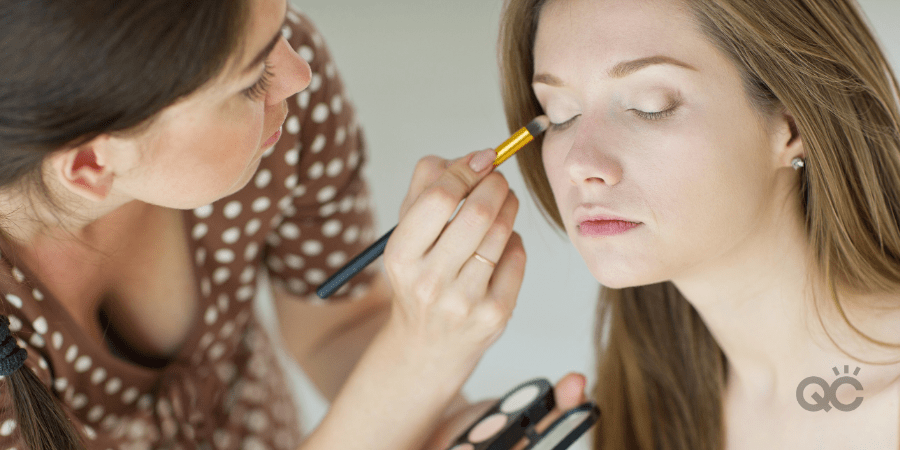 makeup artist doing makeup on client