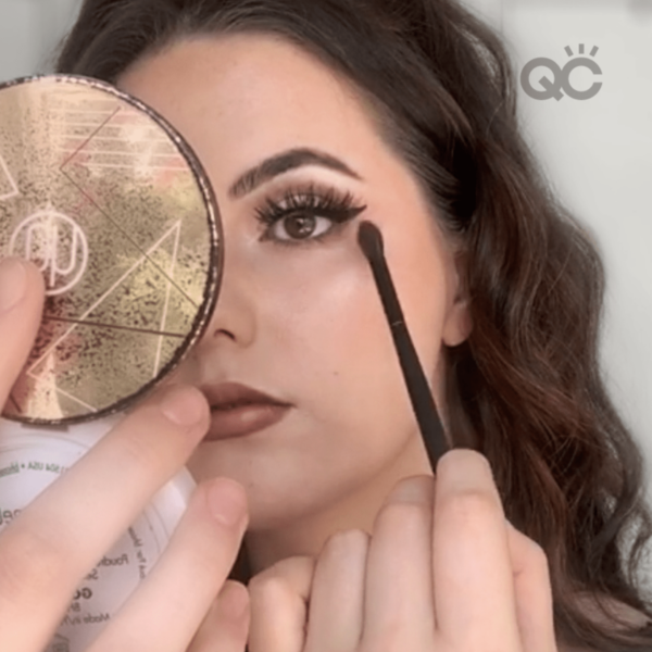 makeup classes graduate, Elly Nunns, doing makeup on herself