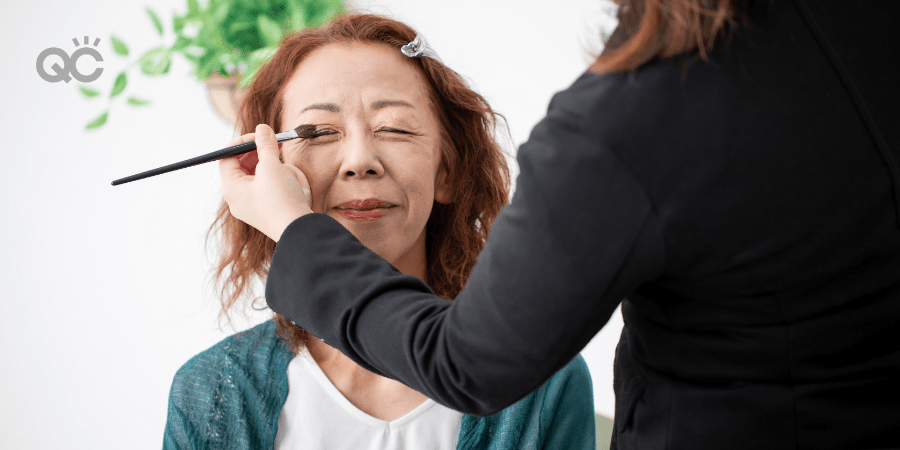 makeup artistry applying makeup to older woman's face