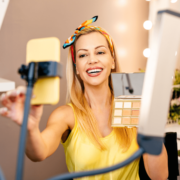 Woman showing makeup on camera