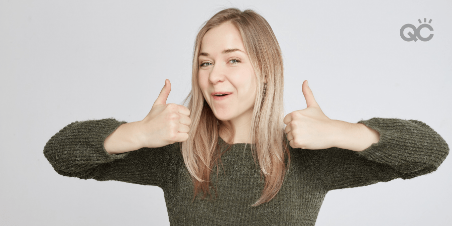 woman giving thumbs up