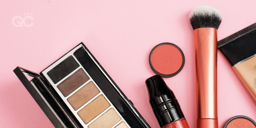 makeup products against pink background