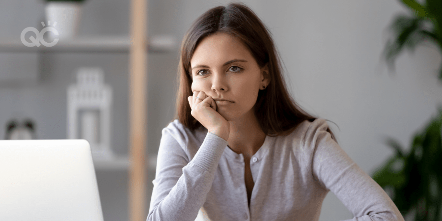 unmotivated woman at laptop