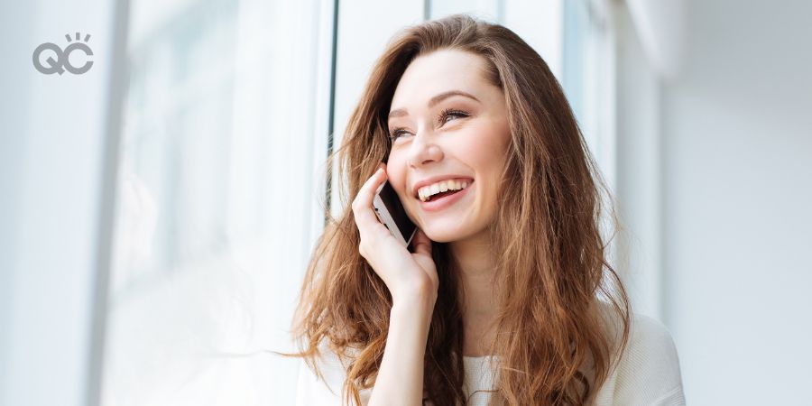 Happy woman on phone at home