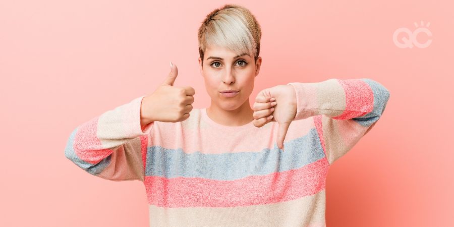 Young woman giving thumb up and thumb down