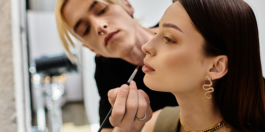 Student of best Canadian makeup school in Toronto gets hands on makeup artistry experience practicing on a model