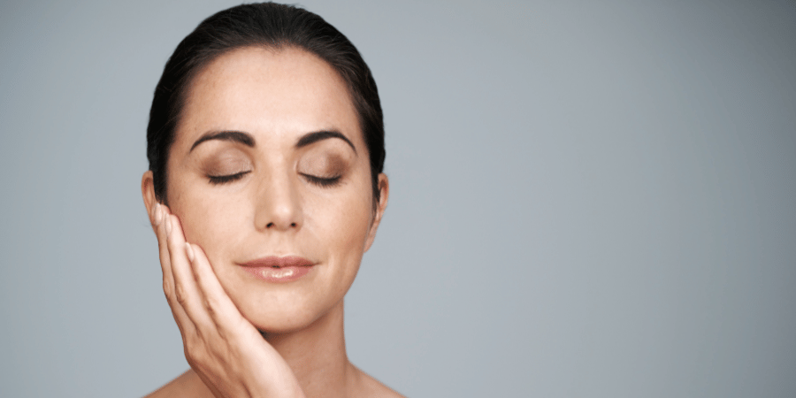 Woman with eye makeup for mature skin. Eyes are closed showing off eyeshadow and eyeliner for aging skin.