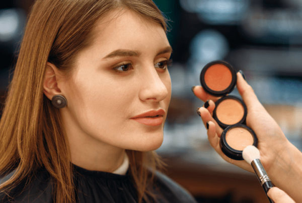 sephora client having makeup applied to them by beauty counter makeup artist