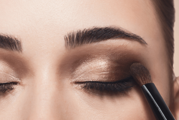 upclose of eyeshadow being applied to woman's eye